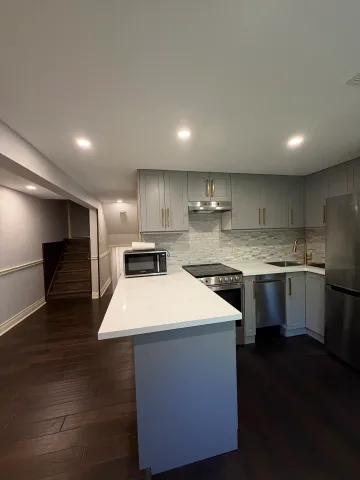 Never-lived-in private walkout ravine view unit.